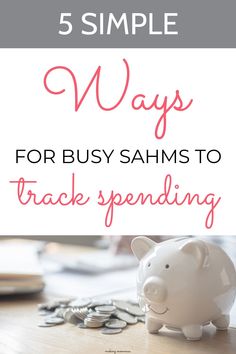 a piggy bank sitting on top of a table next to some coins and the words, 5 simple ways for busy sahms to track spending