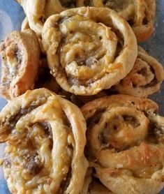 several pastries are stacked on top of each other and ready to be eaten in the oven