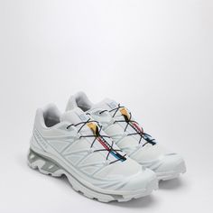 White and silver technical fabric low top trainer by Salomon, features elastic lace-up fastening, rounded toe, logo print on upper and rubber sole.Gender: MenMaterial: 100% Textile materials and others / Rubber soleColor: MULTICOLORMade in: VNProduct ID: L47581100PL/P_SALOM-WF*Import tax/duty will be calculated at checkout (If applicable) Salomon Shoes, Silver Sneakers, Formal Loafers, Elastic Laces, Low Sneakers, Travel Wallets, Shoes Casual, Men's Collection, Leather Accessories