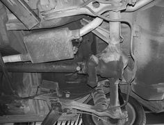 the front end of a car with its brake assembly removed from it's suspension