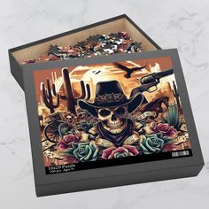 Step into the gothic frontier with our "Wild West Gothic Skull Puzzle." This unique jigsaw puzzle merges the untamed spirit of the west with gothic flair, featuring a skull donning a cowboy hat, dual six shooters, surrounded by roses, majestic hawks soaring above, a noble horse, and a classic broken-down wagon in the backdrop. Puzzles are a wonderful way to unwind with friends and family or a solo activity as a great way to alleviate anxiety and a perfect way to increase mental health by blocking out distractions. Made with premium chipboard pieces, this puzzle promises a satisfying fit and a stunning picture when complete. It's shipped in a gift-ready box that also displays the design, adding an extra layer of excitement for the recipient. Choose from three sizes to fit your puzzle-solvin Gothic Western, Western Skull, Picture Puzzle, Art Puzzle, Picture Puzzles, Unique Puzzles, Puzzle Art, Gothic Decor, Puzzle Solving