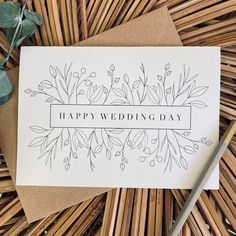 a card with the words happy wedding day on it next to some flowers and leaves