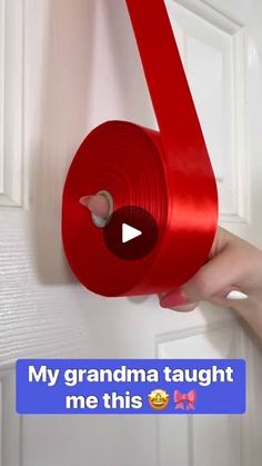 someone is holding a roll of red tape in front of a door with the words, my grandma taught me this