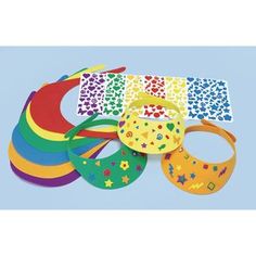 several different types of bibs are arranged on a blue background with stars and dots