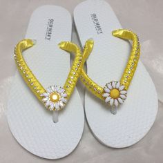 These beautiful flip flops is hand  wrapped with yellow  satin ribbon, and adorned with a matching flower and crystal rhinestones on both side. Ribbon color is yellow  , if you are needing other colors of ribbon or decoration please contact me and will be happy to accommodate you! See last picture for available colors. Also available in adult size.   All flip flops are handmade to order and the production time is 5 to 7 business days and then please allow time for shipping. Amazing for beach, we Adjustable Embellished Flip Flops For Summer, Adjustable Rhinestone Flip Flops For The Beach, Yellow Open Toe Sandals With Rhinestones, Summer Rhinestone Sandals As Gift, Summer Sandals With Rhinestones As Gift, Beach Wedding Flip Flops, Girls Wedding Shoes, Yellow Flip Flops, Bridal Flip Flops