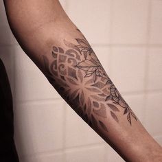 a person with a tattoo on their arm