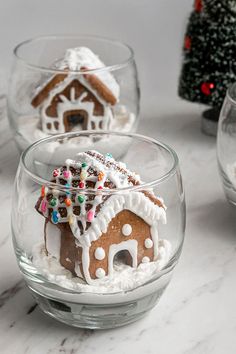 three glass bowls filled with small gingerbread houses