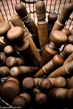 a basket filled with lots of wooden objects