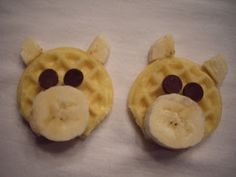 two waffles with faces made to look like a giraffe