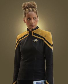 a woman in a star trek uniform holding a tablet