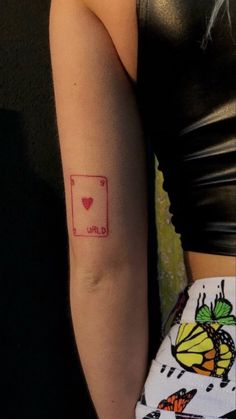 a woman with a small tattoo on her arm