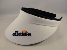 This is a new Ellesse Womens vintage tennis golf visorStyle: Vintage Condition: New Color: WhiteSize: One size fits most• Authentic Ellesse visor• Ellesse name and logo on front• Ellesse logo on underbrim• Rare vintage visor Sporty White Visor For Summer, White Golf Visor For Summer, Sporty White Visor For Outdoor, Casual Adjustable Visor For Golf, Adjustable Casual Golf Visor, Adjustable Casual Visor For Golf, White Breathable Casual Visor, Casual White Breathable Visor, White Casual Visor For Sports