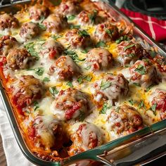 a casserole dish with meatballs and cheese on top, ready to be eaten