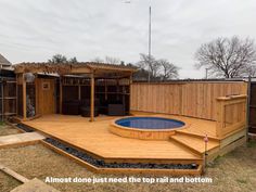 a wooden deck with an above ground pool and hot tub in the middle of it