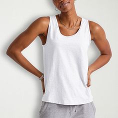 Basics that are far from basic. This cute and comfortable women's tank will get you from here to there in style with ease. Made with recycled polyester, so it's lightweight and has that soft-to-the-touch feel you know and love. A roomy fit that can be dressed up or down. Quality-wise, this tank does the most! Banded collar, armholes, and double-needle stitching on the hem for a fit that won't quit. Grab a few in our basic colors and beef up your staples with these tank tops for women by Hanes originals.Be yourself in Hanes originals - a stylish collection of cool, modern essentials designed for comfort, made for every body.Soft & comfy feel - our best cotton, polyester, and rayon come together to make this soft and comfy women's tank top.Made from recycled materials - made with recycle Casual Everyday Muscle Tank Tee, Casual Cotton Activewear With Scoop Neck, Everyday Athleisure Tank Top, Casual Relaxed Fit Tank Top For Everyday, Basic Racerback Top For Everyday, Basic Summer Tank Top, Relaxed Fit Solid Tank Top For Workout, Basic Sleeveless Vest For Everyday, Basic Sleeveless Everyday Vest