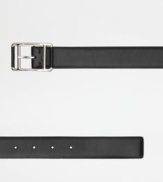 Belt in calfskin leather with branded metal double roller buckle. Classic Black Belt With Palladium Hardware, Designer Leather Belt For Office, Leather Belt With Rectangular Tang Buckle, Leather Belt With Tang Rectangular Buckle, Luxury Leather Belt With Tang Buckle, Sleek Leather Belt For Business, Luxury Leather Belt With Palladium Hardware, Modern Calf Leather Belt With Buckle Closure, Designer Calf Leather Belt For Business