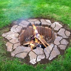 a fire pit made out of rocks with the words summer is coming down about a homemade fire pit