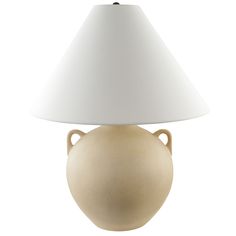 a lamp that is sitting on top of a white table cloth with a beige vase underneath it