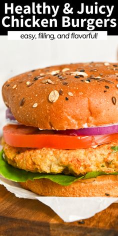 a chicken burger with lettuce, tomato and onion