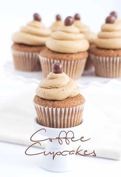 cupcakes with white frosting and chocolate chips on top