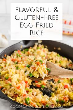 a skillet filled with fried rice and vegetables