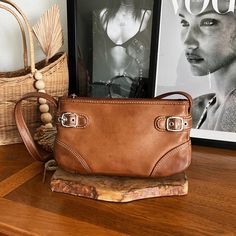 Vintage Tan Leather Shoulder Bag With Built In Wallet, Pen Holder And Inner Pockets. A Perfect Neutral Lifetime Staple For Your Closet, Absolutely Adorable. Please See Photos For Measurements. Please Keep In Mind That When Buying Vintage Items You Are Purchasing Something That Is Pre-Loved. Most Vintage Items Show Signs Of Wear, But That Is Also What Makes Them So Unique. We Do Our Best To Photograph The Item As Best We Can. Vintage Items Will Usually Show A Few Signs Of Slight Fading Due To Age Vintage Tan Shoulder Bag For Daily Use, Vintage Tan Bags With Leather Handles, Dark Tan Leather Shoulder Bag For On-the-go, Distressed Brown Vintage Shoulder Bag With Leather Backing, Western-themed Brown Leather Shoulder Bag, Tan Shoulder Bag, Photos Vintage, Pen Holder, Pen Holders