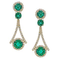 A sumptuous design crafted of 18K yellow gold completes these glittering forest green glowing earrings. Featuring 7.19 carats of perfectly intense Zambian Emeralds, embedded by 1.89 carats of white glistening diamonds. Luxury Green Diamond Earrings With Prong Setting, Luxury Green Emerald Diamond Earrings, Formal Green Diamond Gemstone Earrings, Formal Green Gemstone Diamond Earrings, Elegant Green Diamond Earrings With Brilliant Cut, Luxury Green Earrings With Prong Setting, Green Diamond Earrings For Evening, Green Luxury Earrings With Prong Setting, Elegant Green Emerald Diamond Earrings