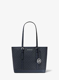 This Jet Set tote bag is the ideal travel companion. A perfect size it’s roomy enough to store your essentials without weighing you down. Logo-print canvas and a silver-tone charm make a luxe statement while a top-zip fastening ensures your belongings will stay in place—whether you’re in flight or on the ground. Michael Kors Outlet, Shoes On Sale, Travel Tote Bag, Zip Tote, Bags Logo, Printed Canvas, Footwear Design Women, Travel Tote, In Flight