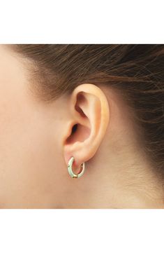 Easy-to-wear hoop earrings will add significant polish to even your most casual ensembles. 1/2" drop; 1/8" width Hinge with snap-post closure Sterling silver with goldtone plate/cubic zirconia Imported Yellow Gold Enamel Hoop Earrings For Pierced Ears, Green Enamel Hoop Jewelry, Hoop Huggie Earrings In Enamel, Elegant Enamel Hoop Earrings, Trendy Green Huggie Hoop Earrings, Modern Everyday Enamel Jewelry, Green Enamel Hoop Earrings, Enamel Ear Wire Jewelry, Small Elegant Enamel Hoop Earrings