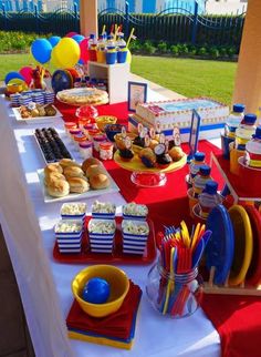 a table topped with plates and cups filled with food