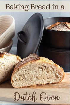 a loaf of bread sitting on top of a cutting board next to an iron skillet