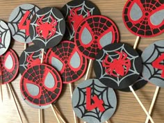 spiderman cupcake toppers are on sticks