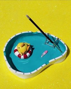 an inflatable rubber duck floating on top of a pool