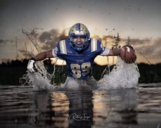 a football player is in the water with his arms out and one hand on his hip