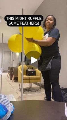 a woman standing next to a table with yellow balloons in front of her and the caption reads, this might ruffle some feathers