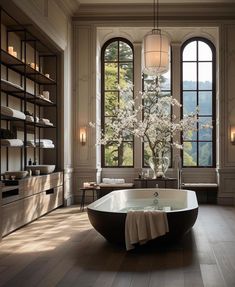 a bathroom with a large tub and windows