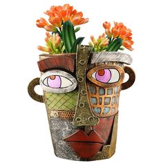 a vase with flowers in it and an artistic face