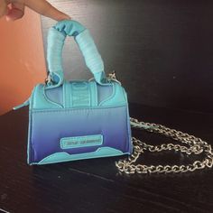 Steve Madden Bdoraa Turquoise Micro Mini Sliver Chain Crossbody Bag Purse Nwt$98 New With Tag Same Day Shipping Smoke And Pets Free Add A Pop Of Color To Your Outfit With This Steve Madden Bdoraa Crossbody Bag. The Turquoise Exterior Is Made Of High-Quality Faux Leather And Features A Silver Chain Strap For A Touch Of Glamour. The Bag Measures 6 Inches In Width, 5 Inches In Height, And 2 Inches In Depth, Making It The Perfect Size For Carrying Your Essentials. The Bag's Closure Is Secure With A Trendy Turquoise Rectangular Shoulder Bag, Trendy Rectangular Turquoise Shoulder Bag, Designer Blue Bag With Chain Strap, Trendy Turquoise Shoulder Bag, Trendy Blue Bag As Fashion Accessory, Blue Top Handle Shoulder Bag With Chain Strap, Blue Shoulder Bag With Top Handle And Chain Strap, Brand Card, Turquoise Fabric