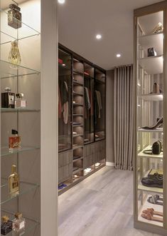 a walk in closet filled with lots of shoes