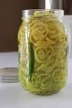 a jar filled with yellow noodles on top of a table