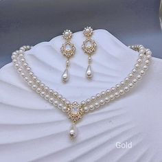 Matching bracelet: https://www.etsy.com/listing/1808388721/3-strand-pearl-gold-wedding-bracelet?click_key=56a2e84b88633130472ceb543914e8d95dca601b%3A1808388721&click_sum=bfd8271e&ref=shop_home_active_1&frs=1&sts=1 https://www.etsy.com/listing/1677593944/multi-strand-pearl-bridal-bracelet?click_key=6ed1b79e5d89cb8165e0269313596b56cd4886eb%3A1677593944&click_sum=9ff32243&ref=shop_home_active_1&frs=1&sts=1 Available in Rose gold, Gold and  White gold(silver tone)  Earrings and necklace can be purch Gold Wedding Earrings, Gold Bracelet Wedding, Gold Earrings Wedding, Pearl Statement Necklace, Pearl Bridal, Matching Bracelet, Bridal Bracelet, Earrings White, Necklace Long