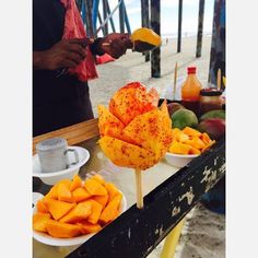 there are many different types of food on the table and one is cut up to look like a flower