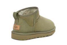 UGG women's casual winter boots Classic Ultra Mini. Lower shaft height boot features sheepskin and flexible, lightweight ultra-durable rubber outsole. twinface sheepskin upper with textile, sheepskin lining. Ugg Ultra Mini Olive, Green Mini Uggs, Mini Ugh Boots, Tiny Ugg Boots, Ugg Classic Ultra Mini Boots, Casual Winter Boots, Running Sneakers Women, Rugged Boots, Mens Boots Fashion