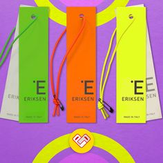 three different colored tags on a purple and green background with the words e, eriskken