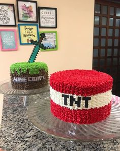 two cakes decorated with red, white and green frosting sitting on top of a counter