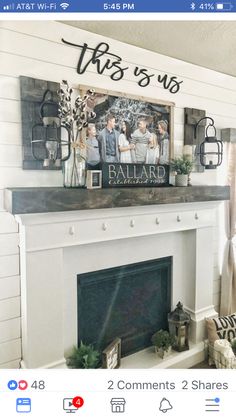 a white fireplace with some pictures on the mantle