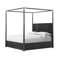 a bed with a metal frame and white sheets