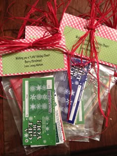 some red and green items are wrapped in clear bags with ribbons on the top one is for sale