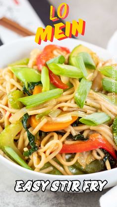 a white bowl filled with noodles and vegetables