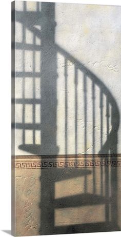 the shadow of a stair case against a wall with a staircase in front of it